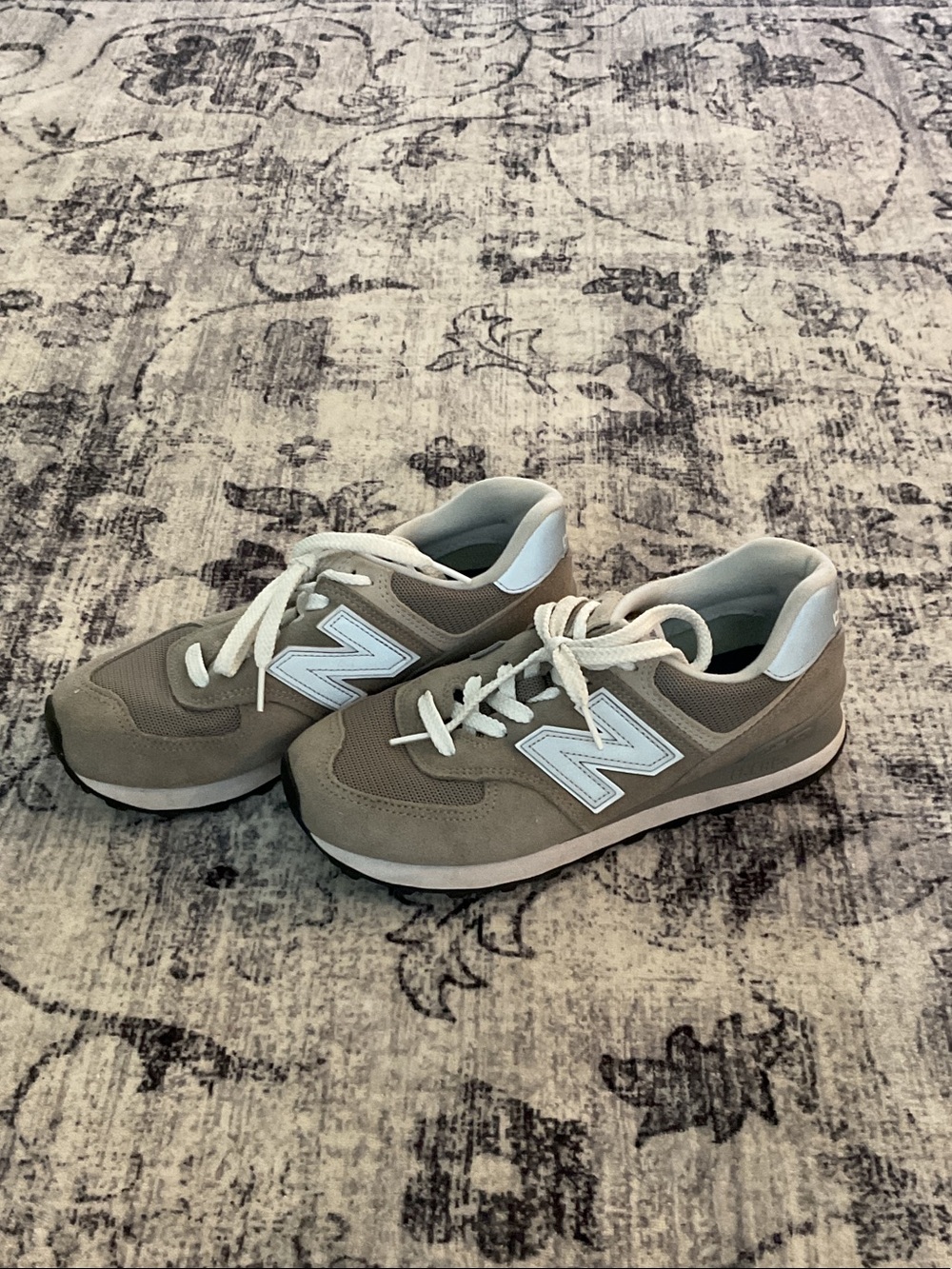 Silver and white new balance shoes
